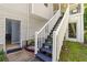 Backyard deck stairs lead to basement entrance, nestled in a landscaped yard at 12 Ranger Se Rd, Cartersville, GA 30121