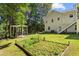Large backyard with a garden and a pergola-covered seating area at 12 Ranger Se Rd, Cartersville, GA 30121