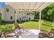 Rear view of home, showing a patio area, backyard, and wooded views at 12 Ranger Se Rd, Cartersville, GA 30121