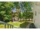 Large backyard with a pergola style seating area and lush landscaping at 12 Ranger Se Rd, Cartersville, GA 30121