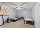 Finished basement space offers two beds, side tables, and neutral carpet flooring at 12 Ranger Se Rd, Cartersville, GA 30121