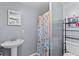 Bathroom with shower/tub combo, a pedestal sink and adequate storage space at 12 Ranger Se Rd, Cartersville, GA 30121