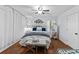 Inviting bedroom with wood floors, a decorative headboard, and abundant natural light at 12 Ranger Se Rd, Cartersville, GA 30121
