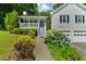 Charming home features a two-car garage, covered front porch, and lush landscaping at 12 Ranger Se Rd, Cartersville, GA 30121