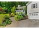 Charming home with a covered front porch, attached garage, and beautiful landscaping at 12 Ranger Se Rd, Cartersville, GA 30121