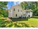 Rear view of a two-story home with porch, back entrance, and lush backyard at 12 Ranger Se Rd, Cartersville, GA 30121