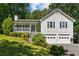 Charming home featuring a covered porch, two-car garage, and beautifully landscaped front yard at 12 Ranger Se Rd, Cartersville, GA 30121