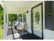 Inviting front porch with seating and a decorative front door at 12 Ranger Se Rd, Cartersville, GA 30121