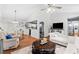 Open-concept living room view with hardwood floors, white walls, and access to the kitchen at 12 Ranger Se Rd, Cartersville, GA 30121