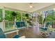 Relaxing covered porch with plenty of seating, ceiling fan and wooded views at 12 Ranger Se Rd, Cartersville, GA 30121