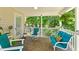 Comfortable covered porch with outdoor seating and lush landscaping at 12 Ranger Se Rd, Cartersville, GA 30121