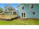 Expansive backyard and deck area on a blue home with mature trees at 1328 Hoy Taylor Dr, Norcross, GA 30093