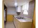 Functional basement kitchenette features stainless steel sink and compact cabinets at 1328 Hoy Taylor Dr, Norcross, GA 30093