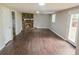 Spacious basement living room with stone fireplace, wood flooring, and walkout access at 1328 Hoy Taylor Dr, Norcross, GA 30093