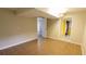 Finished basement room with tile floors, neutral paint, and doorway at 1328 Hoy Taylor Dr, Norcross, GA 30093