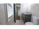 Bright bathroom with granite top sink, tile floors, and natural light from window at 1328 Hoy Taylor Dr, Norcross, GA 30093