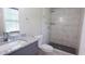 Renovated bathroom with a granite countertop, and a tiled shower at 1328 Hoy Taylor Dr, Norcross, GA 30093