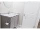 Bathroom features a vanity with granite countertops and gray cabinetry at 1328 Hoy Taylor Dr, Norcross, GA 30093