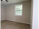 Bedroom featuring a window with natural light and plush carpeting at 1328 Hoy Taylor Dr, Norcross, GA 30093