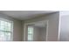 Bedroom showcasing mirrored closet doors and two windows at 1328 Hoy Taylor Dr, Norcross, GA 30093
