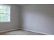 Bedroom features a large window with lots of natural light and neutral paint scheme at 1328 Hoy Taylor Dr, Norcross, GA 30093