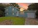 Charming two-story home with an attached garage, set against a vibrant sunset sky at 1328 Hoy Taylor Dr, Norcross, GA 30093