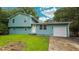 Charming two-story home featuring an attached garage and well-maintained lawn at 1328 Hoy Taylor Dr, Norcross, GA 30093