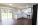 Open-concept kitchen featuring stainless steel appliances, granite counters, and access to the backyard at 1328 Hoy Taylor Dr, Norcross, GA 30093