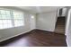 Inviting living room featuring hardwood floors, staircase, and lots of light at 1328 Hoy Taylor Dr, Norcross, GA 30093