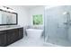 Stylish bathroom with soaking tub and glass-enclosed shower at 2113 Ella Springs Dr, Covington, GA 30014