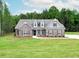 Charming brick home with a well-manicured lawn and inviting curb appeal at 2113 Ella Springs Dr, Covington, GA 30014