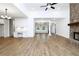 Spacious living room with hardwood floors and brick fireplace, perfect for entertaining at 2113 Ella Springs Dr, Covington, GA 30014