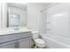Clean bathroom featuring a shower-tub combination and single sink vanity with storage at 2309 Rolling Trl, Lithonia, GA 30058
