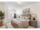 Cozy bedroom with neutral tones, large window, carpet flooring, ceiling fan and ample natural light at 2309 Rolling Trl, Lithonia, GA 30058