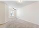 Bedroom featuring carpet, a ceiling fan, and a window that provides natural light at 2309 Rolling Trl, Lithonia, GA 30058