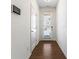 Bright entryway with hardwood floors, white walls, and a view of the front door at 2309 Rolling Trl, Lithonia, GA 30058