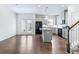 Open-concept kitchen with a center island, stainless appliances, and hardwood floors at 2309 Rolling Trl, Lithonia, GA 30058