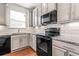 Kitchen featuring granite countertops, stainless steel appliances, and under cabinet lighting at 2309 Rolling Trl, Lithonia, GA 30058