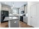 Modern kitchen with stainless steel appliances, a center island, and gray cabinetry at 2309 Rolling Trl, Lithonia, GA 30058