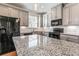 Kitchen featuring granite countertops, stainless steel appliances, and gray cabinetry at 2309 Rolling Trl, Lithonia, GA 30058