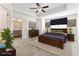 Spacious main bedroom with a tray ceiling, ceiling fan, carpet flooring, and ensuite bathroom at 2309 Rolling Trl, Lithonia, GA 30058