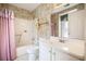 Functional bathroom with a combined tub and shower, complete with a vanity and neutral décor at 3244 Hampton Se Ct, Smyrna, GA 30082