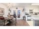 Charming dining area with a table set for a meal, adjacent to the kitchen and a view of the backyard at 3244 Hampton Se Ct, Smyrna, GA 30082