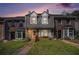 Charming townhome with brick facade, dormer windows, and inviting front lawn at 3244 Hampton Se Ct, Smyrna, GA 30082