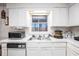 Practical kitchen space with essential appliances and an abundance of natural light at 3244 Hampton Se Ct, Smyrna, GA 30082