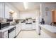 Cozy kitchen featuring white cabinets and essential appliances, perfect for cooking and everyday meals at 3244 Hampton Se Ct, Smyrna, GA 30082