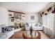 Inviting living room featuring a cozy fireplace, comfortable seating, and a warm ambiance at 3244 Hampton Se Ct, Smyrna, GA 30082