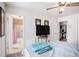 Comfortable main bedroom with en-suite bathroom access, a TV, and neutral color scheme at 3244 Hampton Se Ct, Smyrna, GA 30082