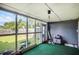 Enclosed sunroom offering views of the backyard and a space for relaxation at 3244 Hampton Se Ct, Smyrna, GA 30082