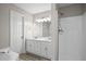 Bathroom featuring double vanity, large shower with glass door, soaking tub, and gray walls at 1027 Regency Dr, Acworth, GA 30102